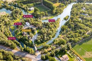 an aerial view of a river with trees at Private Island Fire Pit & Arcade in Rigby