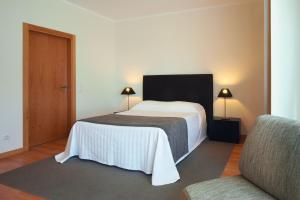Cama ou camas em um quarto em Real Marina Residence