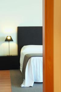 Cama ou camas em um quarto em Real Marina Residence
