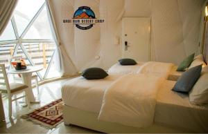 Postel nebo postele na pokoji v ubytování WADl RUM DESERT CAMP