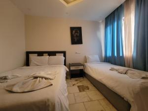 Postel nebo postele na pokoji v ubytování shah sultan Ozturk Hotel