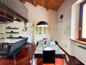 a dining room with a long table and chairs at Centro Jesi Elegant Apartment in Iesi
