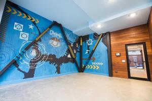 a room with a mural of a cow on the wall at Unit 23 Comfy 1BR Apartment Long-term stays in Chelsea