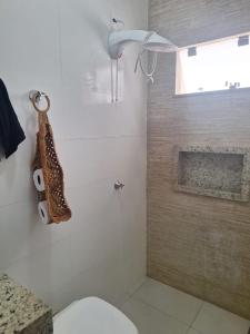 a bathroom with a toilet and a shower at Apartamento vest unirv in Rio Verde