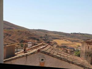 a view of a village with buildings and a mountain at Casa Chaparrete in Deza