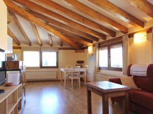a living room with a couch and a table at Casa Chaparrete in Deza