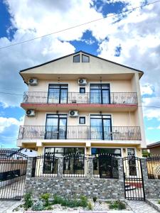 a building with balconies on the side of it at Vila Sedef Costinești in Costinesti