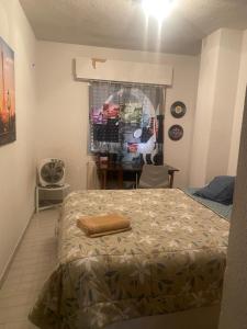 a bedroom with a bed and a window at Paris in Alcalá de Henares