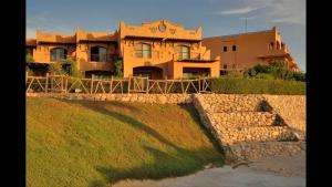 a large house sitting on top of a hill at La Hacinda لا سيندا للعائلات in Ras Sedr +2 photos