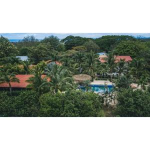 a view of a resort with a pool and trees at Drift Away Lodge CR in Santa Cruz