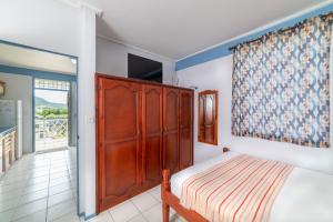 Postel nebo postele na pokoji v ubytování Safari Apartments