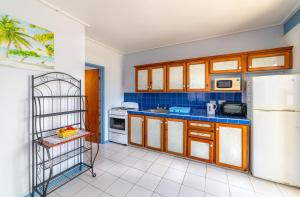 Kuchyň nebo kuchyňský kout v ubytování Safari Apartments + 9 fotografií
