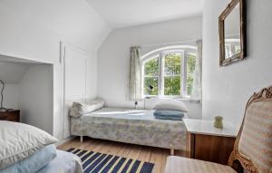 Voodi või voodid majutusasutuse Cozy Home In Faxe Ladeplads With Wifi toas