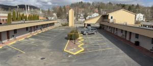 a parking lot with a car parked in it at Mansfield Inn in Mansfield