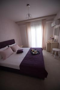 Postel nebo postele na pokoji v ubytování Aloe Apartments Ammouliani