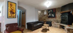 a living room with a couch and a fireplace at Luna de Borobia in Borobia
