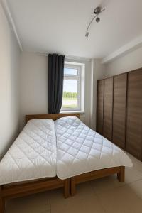 Postel nebo postele na pokoji v ubytování Zimmer in Rheinfelden Basel
