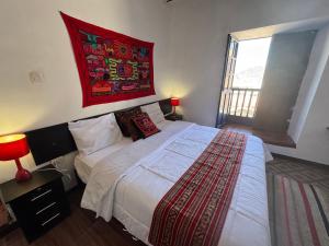 Postel nebo postele na pokoji v ubytování Mallku Wasi - Lodging Hotel Cusco