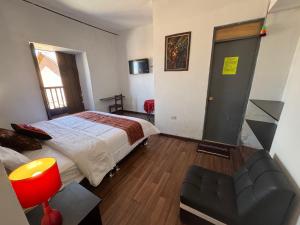 Postel nebo postele na pokoji v ubytování Mallku Wasi - Lodging Hotel Cusco