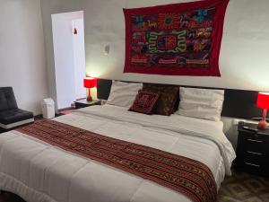 Postel nebo postele na pokoji v ubytování Mallku Wasi - Lodging Hotel Cusco