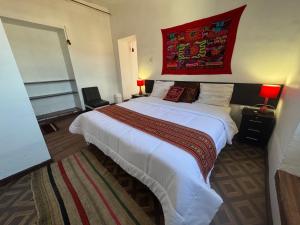 Postel nebo postele na pokoji v ubytování Mallku Wasi - Lodging Hotel Cusco