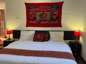 Postel nebo postele na pokoji v ubytování Mallku Wasi - Lodging Hotel Cusco
