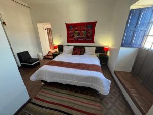 Postel nebo postele na pokoji v ubytování Mallku Wasi - Lodging Hotel Cusco