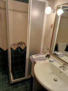 a bathroom with a sink and a shower at Mantemi house in Skopelos Town +37 photos