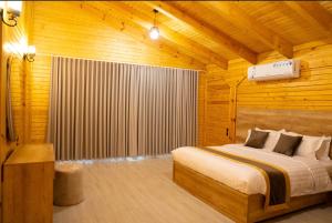 En eller flere senge i et værelse på مزرعة واكواخ ريف الازهر + 14 billeder