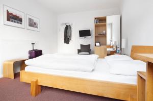 Postel nebo postele na pokoji v ubytování Hotel an der Marienkirche