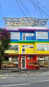 a colorful building on the side of a street at CasaColibri in Pasto