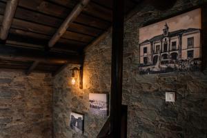 a wall with a painting of a house on it at Di&Ana III - Alojamento Redondo in Redondo +16 photos