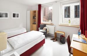 Postel nebo postele na pokoji v ubytování Hotel an der Marienkirche