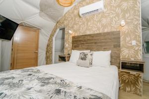 Postel nebo postele na pokoji v ubytování Glamping Tortuga Verde