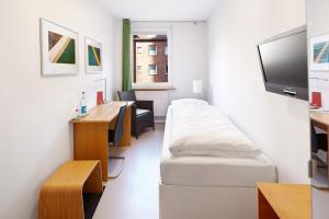 TV a/nebo společenská místnost v ubytování Hotel an der Marienkirche