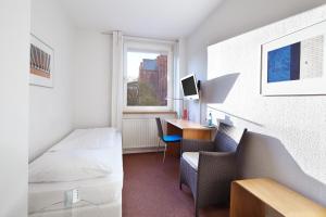 TV a/nebo společenská místnost v ubytování Hotel an der Marienkirche