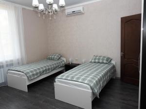 Postel nebo postele na pokoji v ubytování Guest House Prestige