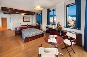 Postel nebo postele na pokoji v ubytování Hotel Bellavista Club-Caroli Hotels