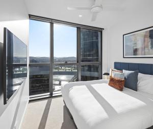 Queen's Wharf Residences客房内的一张或多张床位