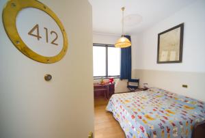 Postel nebo postele na pokoji v ubytování Hotel Bellavista Club-Caroli Hotels