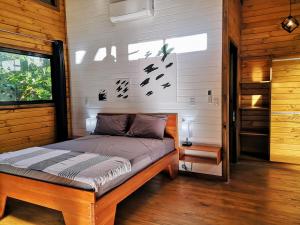 Postel nebo postele na pokoji v ubytování Thoas Lodge