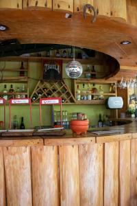 a kitchen with wooden walls and a counter with a counter at Alla Arriba in Las Cruces