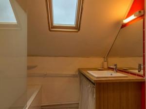 a bathroom with a sink and a mirror at Charmante maison de paludier à Guérande, proche mer, jardin, tyrolienne, WIFI, Canal+, équipements bébé - FR-1-306-1102 in Guérande +5 photos