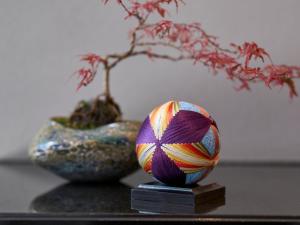 two vases and a plant on a table at Hotel Resol Trinity Kanazawa in Kanazawa