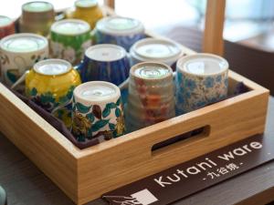 a wooden box filled with different types of glass at Hotel Resol Trinity Kanazawa in Kanazawa +37 photos