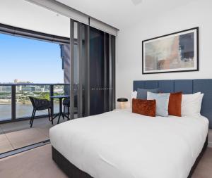 Queen's Wharf Residences客房内的一张或多张床位