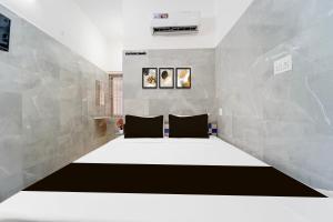 Postel nebo postele na pokoji v ubytování Super Hotel O Coimbatore Hopes College