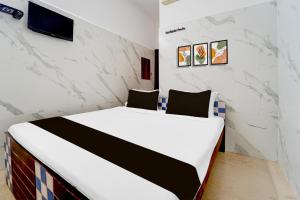 Postel nebo postele na pokoji v ubytování Super Hotel O Coimbatore Hopes College