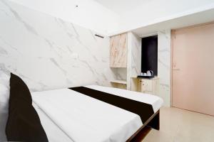 Postel nebo postele na pokoji v ubytování Super Hotel O Coimbatore Hopes College