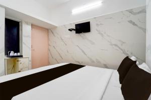 Postel nebo postele na pokoji v ubytování Super Hotel O Coimbatore Hopes College